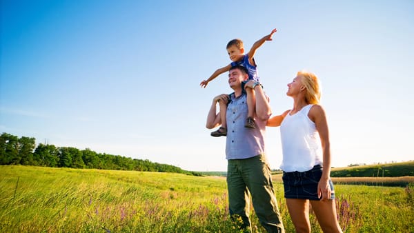 Happy family in nature enjoying their health