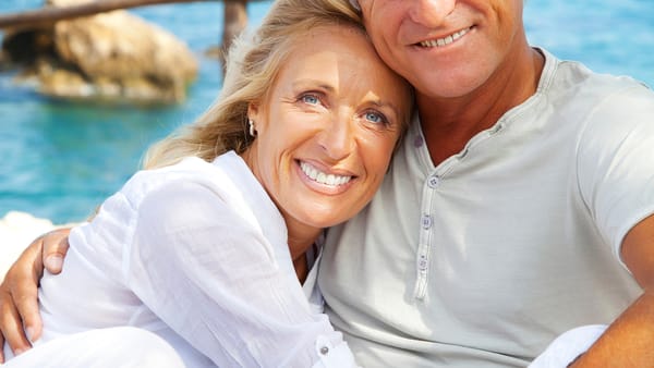 Older couple with water in the background