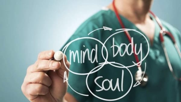 Mind, Body, Soul written on glass by a doctor