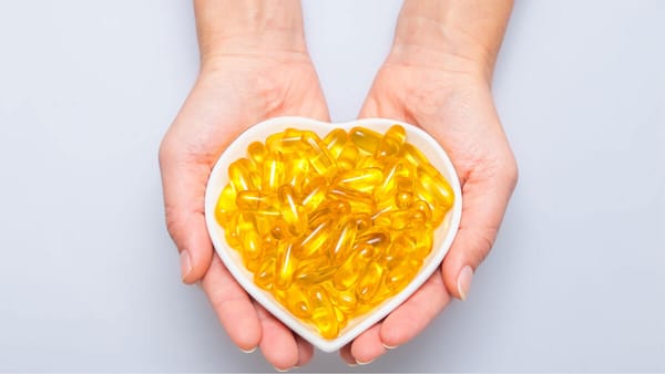 Omega 3 supplements in a heart shaped bowl