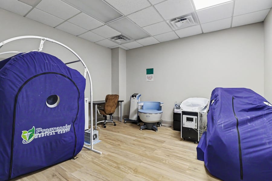 PMC's PEMF therapy chair alongside the hyperbaric chambers