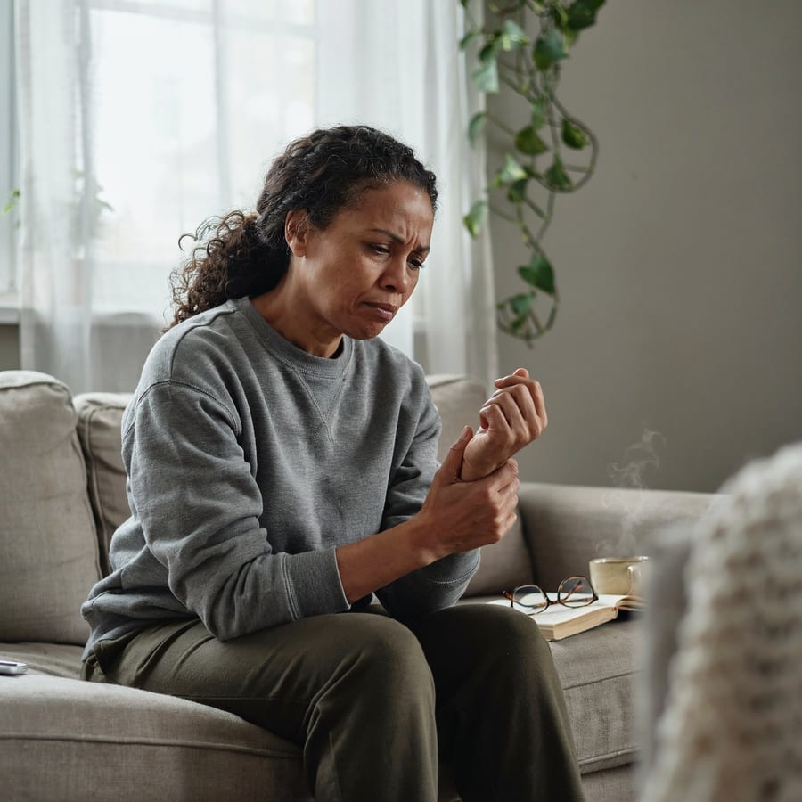 A woman with wrist and joint pain